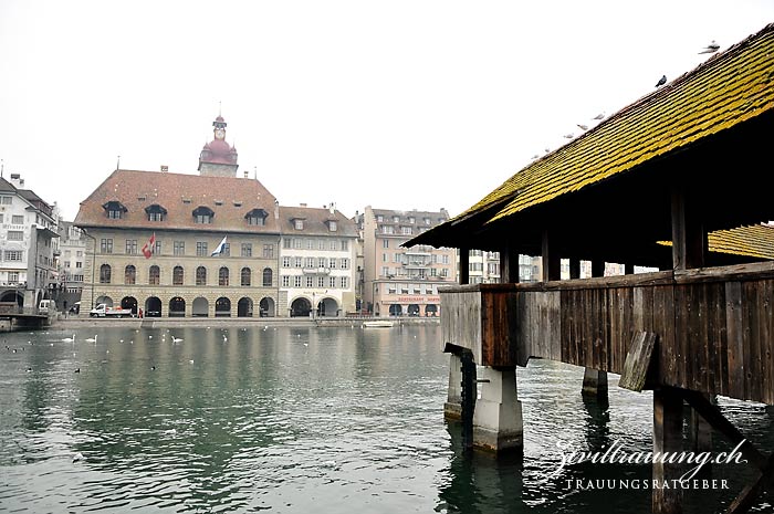 Lucerne town hall (large building with tower) as seen from the other side of the river