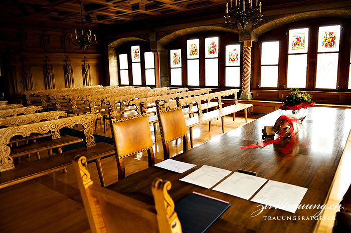 The wedding couple sits on the left, the witnesses on the right